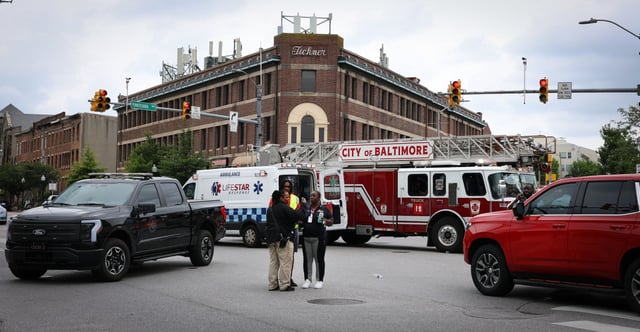 Baltimore police and fire officials respond to a series of overdoses at the intersection of Pennsylvania and North avenues, where more than 15 people were reported to have overdosed by noon. First responders treated three people behind a CVS around 9:30 a.m., and additional cases were reported nearby, including near Penn Station and the Enoch Pratt Free Library. Narcan was distributed by community groups on site, and a mobile command center was established as people were transported to area hospitals for treatment. (Nia Meyers/Staff)