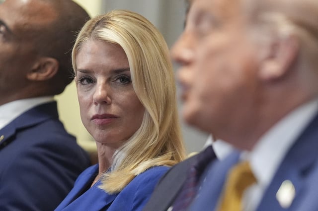 Attorney General Pam Bondi, left, listens as President Donald Trump, right, speaks during a cabinet meeting at the White House, Tuesday, July 8, 2025, in Washington. (AP Photo/Evan Vucci)