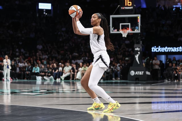 Jul 8, 2025; Brooklyn, New York, USA;  Las Vegas Aces center A'ja Wilson (22) takes a three point shot in the first quarter against the New York Liberty at Barclays Center. Mandatory Credit: Wendell Cruz-Imagn Images/File Photo