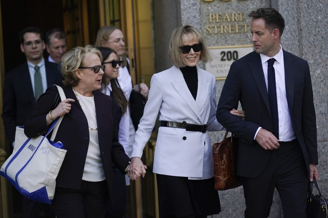E. Jean Carroll, second from right, leaves federal court in New York, Monday, May 8, 2023.