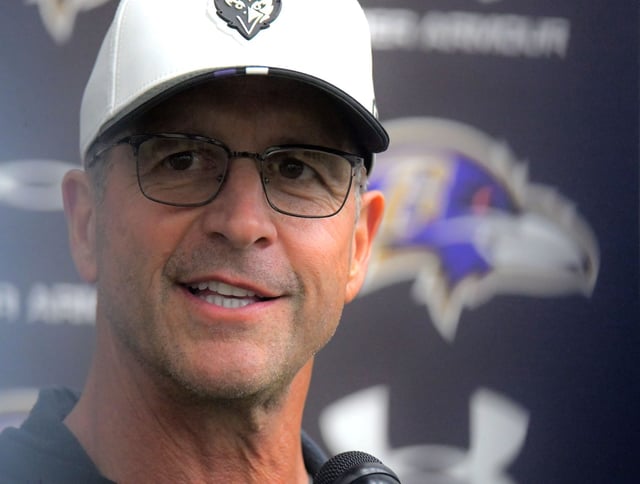 Baltimore Ravens head football coach John Harbaugh speaks during practice at the Ravens training facility. (Karl Merton Ferron/Staff)