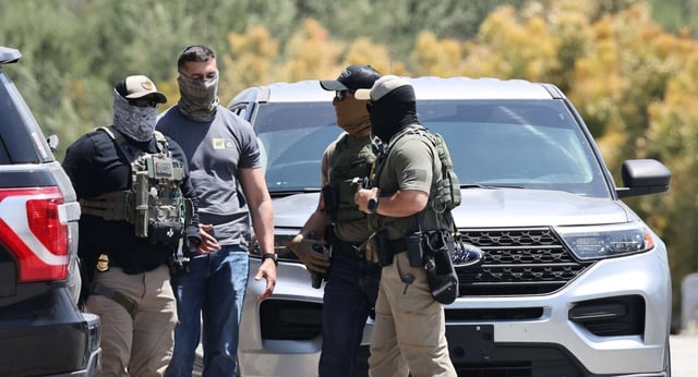 Masked federal agents staged outside a gate of Dodger Stadium on June 19, 2025. The Los Angeles Dodgers said in a statement that federal agents requested permission to access Dodger Stadium parking lots but were denied entry. On Tuesday, July 1, the LA County Board of Supervisors and the Los Angeles City Council both voted to pursue lawsuits against ICE to stop the raids or at least provide warrants and due process. (Photo by Mario Tama/Getty Images)(Photo by Mario Tama/Getty Images)