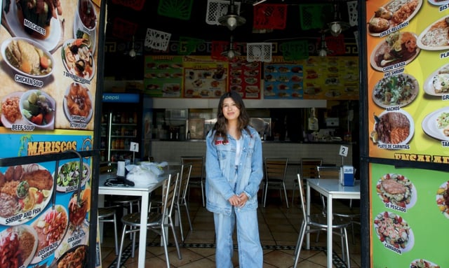 Nayomie Mendoza, owner of Cuernavaca's Grill, poses for a portrait at her restaurant in the Fashion District of Los Angeles