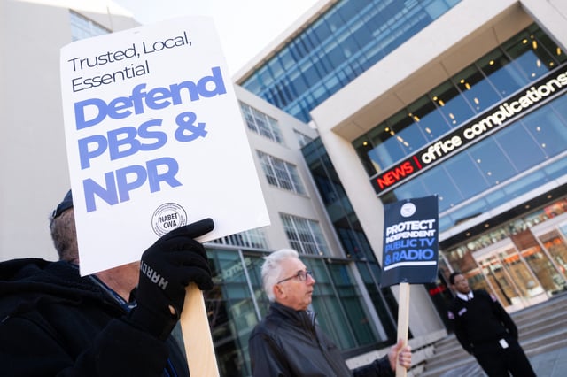 People participate in a rally to call on Congress to protect funding for US public broadcasters, Public Broadcasting Service (PBS) and National Public Radio (NPR), outside the NPR headquarters in Washington, DC, on March 26, 2025.