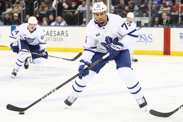 Feb 28, 2025; New York, New York, USA;  Toronto Maple Leafs right wing Ryan Reaves (75) controls the puck in the second period against the New York Rangers at Madison Square Garden. Mandatory Credit: Wendell Cruz-Imagn Images/File Photo