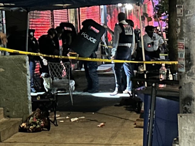 NYPD at the scene where  two men and a woman were shot at a barbecue outside 212 East 122nd Street in Manhattan on July 10, 2025. (Kerry Burke/New York Daily News)
