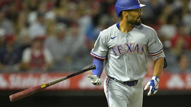 Jul 9, 2025; Anaheim, California, USA;  Texas Rangers second baseman Marcus Semien (2) hits a two-run home run during the seventh inning against the Los Angeles Angels at Angel Stadium. Mandatory Credit: Jayne Kamin-Oncea-Imagn Images