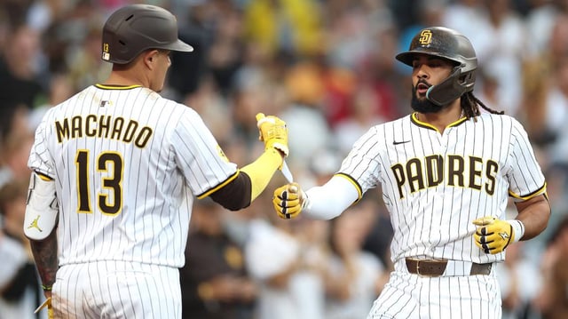 The San Diego Padres’ Manny Machado congratulates Fernando Tatis Jr. after his solo home run during the third inning against the Arizona Diamondbacks at Petco Park on Thursday, July 10, 2025, in San Diego. (Sean M. Haffey/Getty Images/TNS)