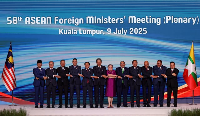 Indonesian Minister for Foreign Affairs Sugiono, Lao Minister of Foreign Affairs Thongsavanh Phomvihane, Singaporean Minister for Foreign Affairs Vivian Balakrishnan, Thailand's Minister of Foreign Affairs Maris Sangiampongsa, Vietnamese Deputy Prime Minister and Minister of Foreign Affairs Bui Thanh Son, Malaysian Minister of Foreign Affairs Mohamad Hasan, Bruneian Second Minister of Foreign Affairs Erywan Mohd. Yusof, Filipino Secretary of Foreign Affairs Theresa P. Lazaro, Cambodian Deputy Prime Minister and Minister of Foreign Affairs and International Cooperation Prak Sokhonn, Myanmar's Director-General for International Organizations and Economic Development Kyaw Nyun Oo, Timor-Leste Minister of Foreign Affairs and Cooperation Bendito dos Santos Freitas and Secretary General of the ASEAN Kao Kim Hourn join hands for a group photo during the 58th Association of Southeast Asian Nations (ASEAN) Foreign Ministers' meeting and related meetings at the Convention Centre in Kuala Lumpur, Malaysia, July 9, 2025. REUTERS/Hasnoor Hussain