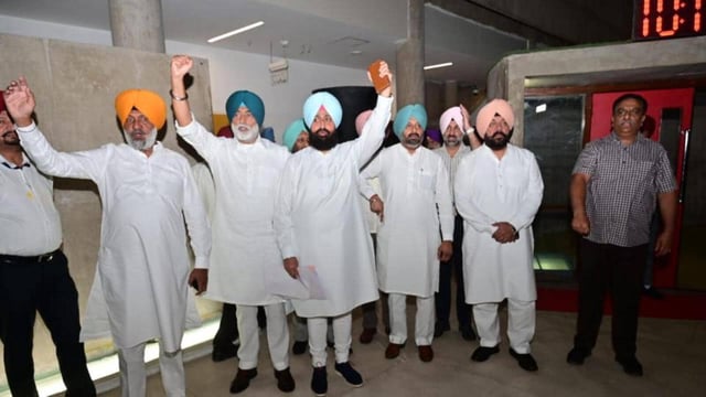 Leader of opposition Partap Singh Bajwa (centre) raising slogans along with other Congress MLAs after they walked out of the Punjab assembly in Chandigarh on Friday. (Ravi Kumar/HT)