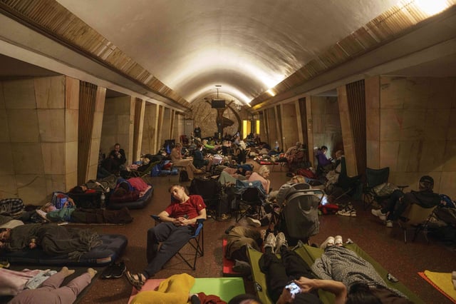 People sleep on the platform of a metro station as they take cover during a Russian attack on Kyiv, Ukraine, on Thursday, July 10, 2025. (AP Photo/Evgeniy Maloletka)