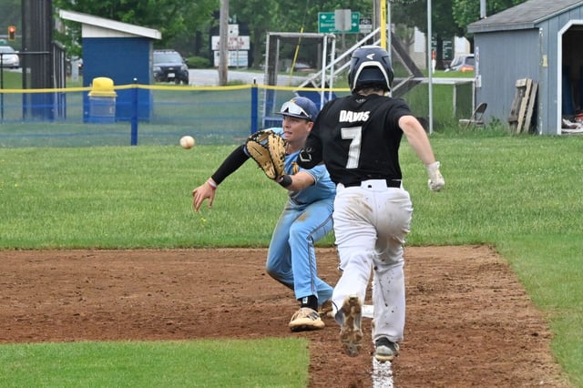 Liberty first baseman Braeden Chubb catches the ball at first base prior to Pikesville&#39;s Ian Davis touching the bag during a playoff game this season. Plays like this will be safer in 2027 when the NFHS mandates a double first base be used in all high school baseball games. (Thomas Walker/Freelance)