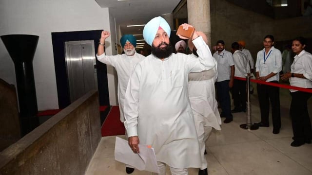 Leader of opposition and Congress MLA Partap Singh Bajwa walking out of the Punjab Vidhan Sabha on Friday. (Ravi Kumar/HT)