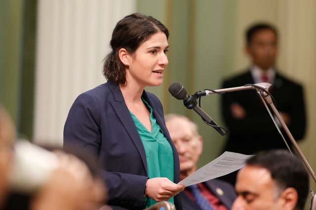 FILE — In this Jan 21, 2020 file photo Democratic Assemblywoman Rebecca Bauer-Kahan speaks during the Assembly session at the Capitol in Sacramento, Calif. On Friday, Sept.10, 20221, Bauer-Kahan spoke in a support of a bill that would stop police in California from arresting anyone for loitering with the intent to engage in prostitution. Lawmakers approved the measure, by state Democratic state Sen. Scott Wiener. (AP Photo/Rich Pedroncelli, File)