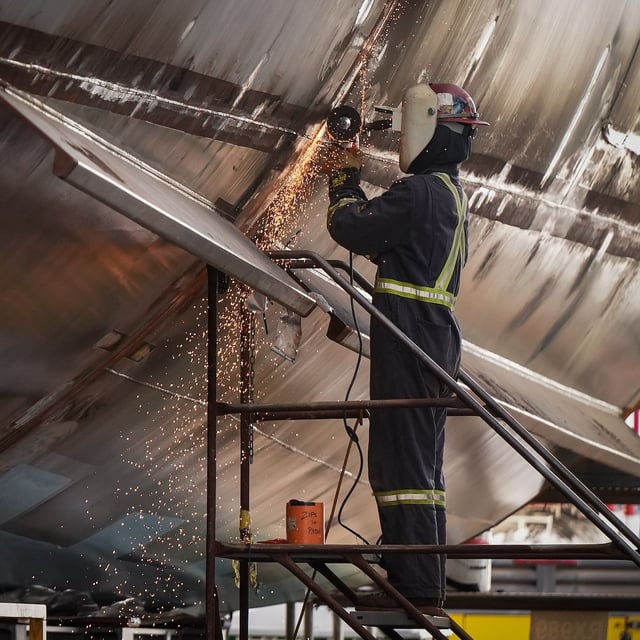 Statistics Canada is set to report June employment figures on Friday. A worker uses an angle grinder on a vessel under construction at Seaspan Shipyards, in North Vancouver, B.C., on Thursday, October 10, 2024. THE CANADIAN PRESS/Darryl Dyck