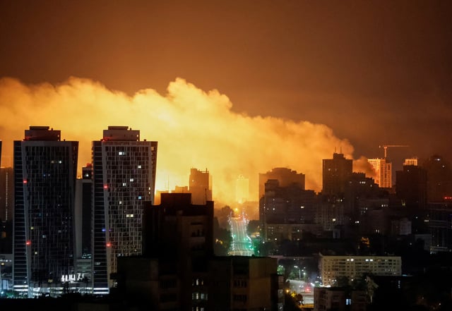 An explosion of a drone lights up the sky over the city during a Russian drone and missile strike, amid Russia's attack on Ukraine, in Kyiv, Ukraine July 10, 2025. REUTERS/Gleb Garanich/File Photo