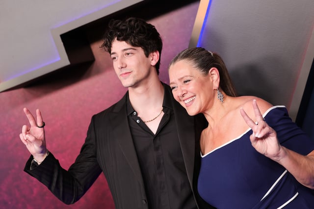 Milo Manheim poses with mom Camryn Manheim at the world premiere of Disney's "Zombies 4: Dawn of the Vampires."