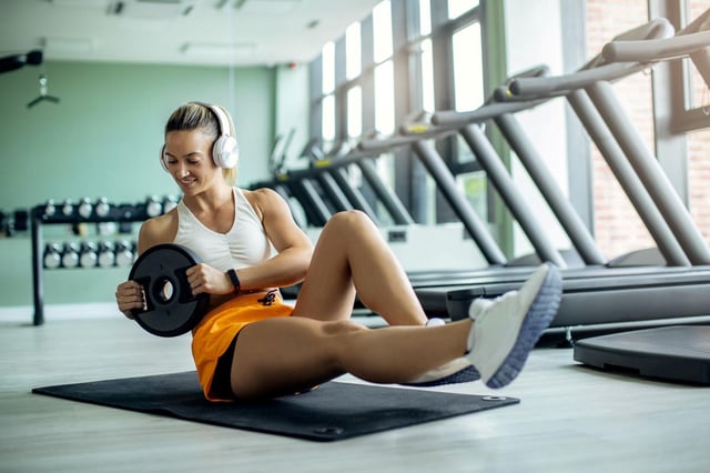 Young athletic woman exercising situps