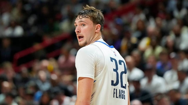 Dallas Mavericks forward Cooper Flagg (32) looks on against the Los Angeles Lakers in the second quarter of their game at Thomas & Mack Center in his pro basketball debut on Thursday, July 10, 2025.