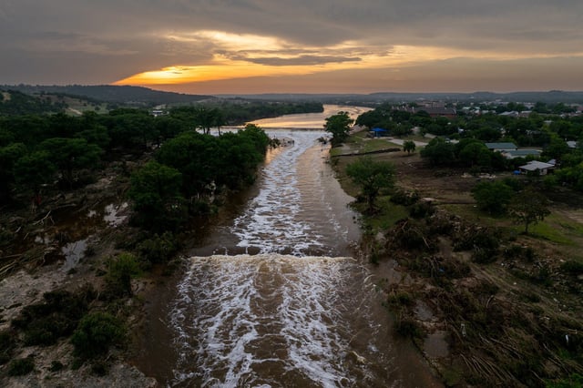 The sun sets over the Guadalupe River on July 06, 2025 in Kerrville, Texas. Heavy rainfall caused severe flooding along the Guadalupe River in central Texas, leaving more than 80 people reported dead. 