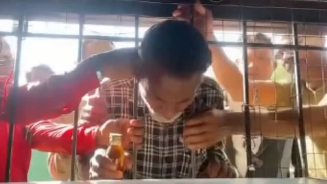 Drunk man gets head stuck in liquor shop grill while trying to grab alcohol | Image: X