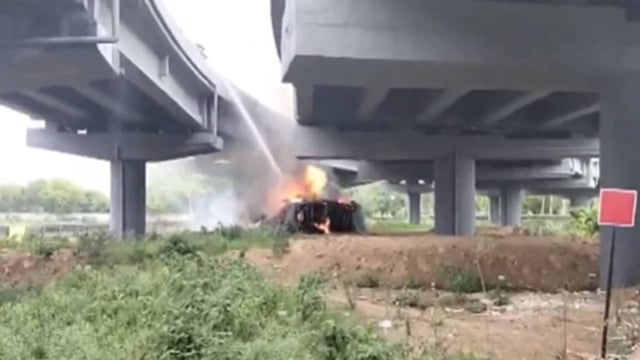 Truck Full Of Chemicals Falls From Delhi-Mumbai Expressway Flyover In Gurugram, Catches Fire After Blast | VIDEO | Image: X