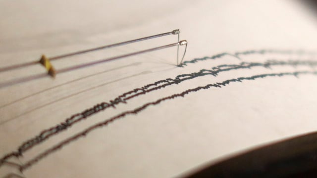 A working seismograph is shown in a display about earthquakes. 
