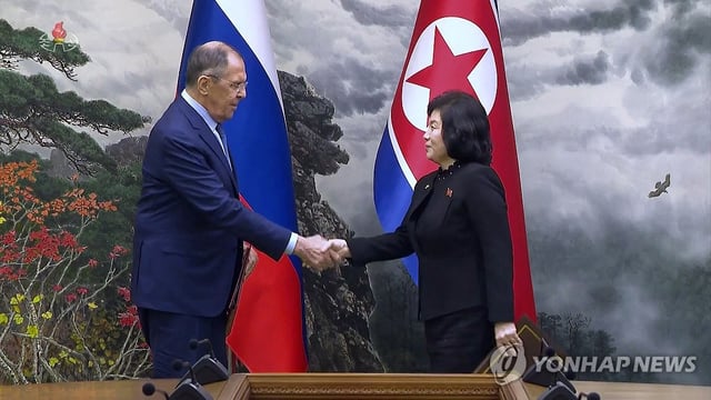 This photo, captured from a broadcast of the Korean Central TV, shows Russian Foreign Minister Sergei Lavrov shaking hands with North Korean Foreign Minister Choe Son-hui as they meet for talks in Pyongyang on Oct. 19, 2023. (For Use Only in South Korea. No Redistribution) (Yonhap)