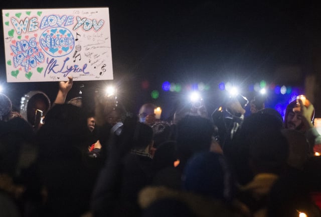 People attend a vigil in memory of Nicous D'Andre Spring in Montreal, Friday, Dec. 30, 2022. Spring died in hospital after reportedly suffering injuries on Saturday, Dec. 24, at the Bordeaux provincial jail. THE CANADIAN PRESS/Graham Hughes