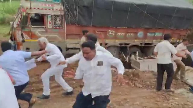 Some even jumped into the pit dug for construction so as to not get crushed under the truck, shows video. 