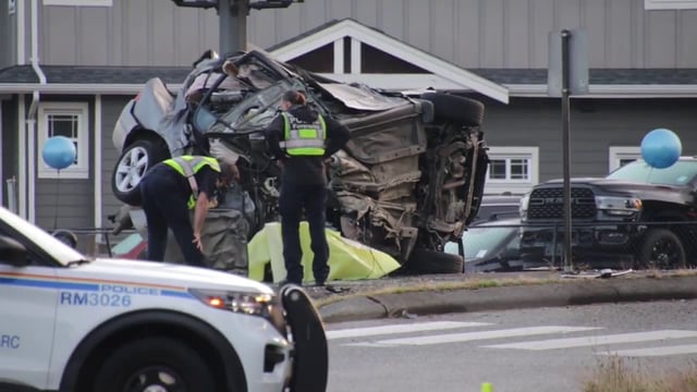 Investigators on the scene of a fatal single-vehicle crash in Maple Ridge on Lougheed Highway on Friday morning.