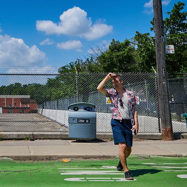 Commuters wait for public transit in Toronto’s east end as the city grapples with a heat wave on June 23, 2025. (Sammy Kogan/The Globe and Mail)