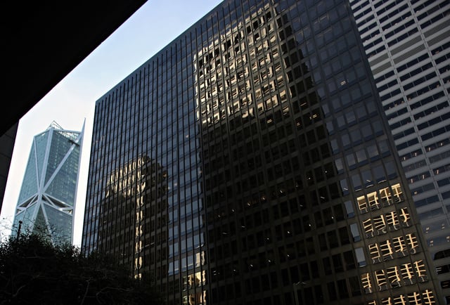 The former PG&amp;E building is reflected on the front of the 50 Beale St. building in San Francisco, in 2018. A tower is proposed to replace the PG&amp;E buildings that would stand taller than Salesforce Tower.