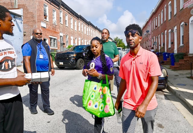 Mayor Brandon Scott walks through the Penn North neighborhood following a media briefing earlier this morning. (Kenneth K. Lam/Sun Staff)
