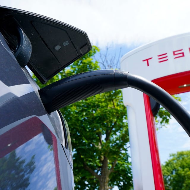 An electric vehicle is charged at a Tesla charging station in Ottawa on Wednesday, July 13, 2022. THE CANADIAN PRESS/Sean Kilpatrick