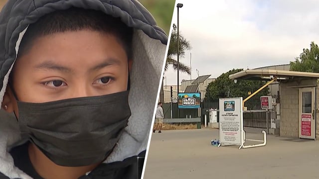 A young boy waits to reunite with his mother after an immigration enforcement operation  in Camarillo. 