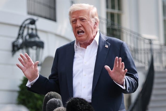 President Donald Trump answers questions while leaving the White House on July 11.
