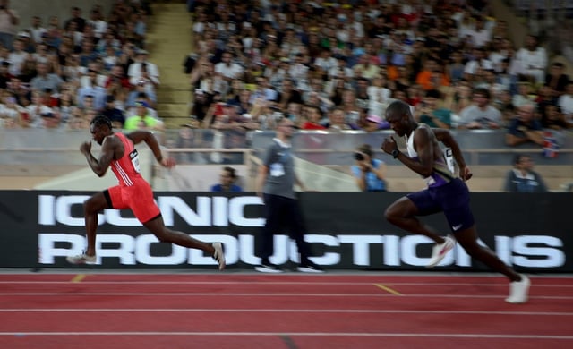 US sprinter Noah Lyles (L) and Botswana's Letsile Tebogo race the 200m at the Monaco Diamond League