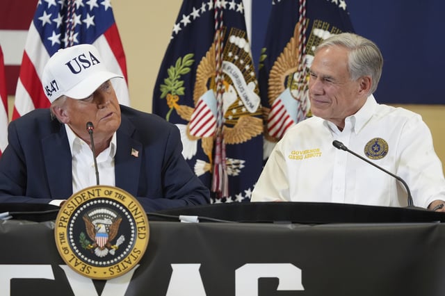President Donald Trump, left, speaks as Texas Gov. Greg Abbott listens during a roundtable discussion with first responders and local officials at Hill Country Youth Event Center in Kerrville, Texas, during a tour to observe flood damage, Friday, July 11, 2025.