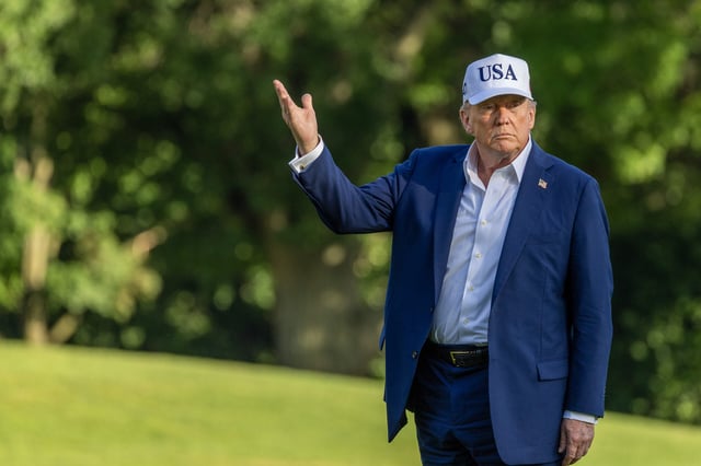 WASHINGTON, DC - JULY 06: U.S. President Donald Trump looks up at the new flag on the south lawn of the White House on July 06, 2025 in Washington, DC. President Trump is returning from a 4th of July weekend in Bedminster. (Photo by Tasos Katopodis/Getty Images)