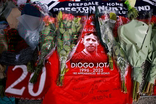 Tributes are placed outside Anfield Stadium, following the death of Liverpool Football Club soccer player Diogo Jota, in Liverpool, Britain, July 7, 2025. REUTERS/Phil Noble/File Photo