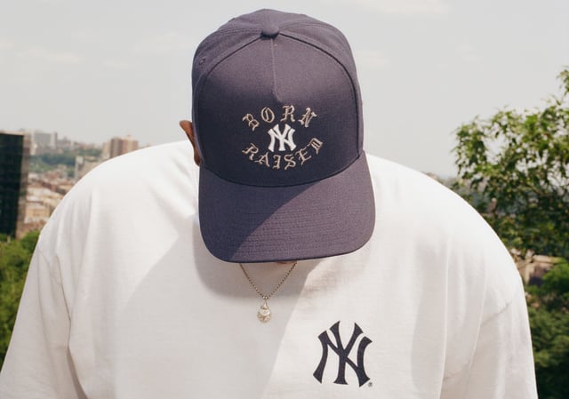 Kunle Martins wearing a Born X Raised x Yankees hat and t-shirt.