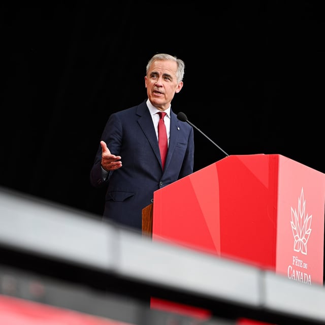 Prime Minister Mark Carney speaks during Canada Day celebrations at LeBreton Flats in Ottawa.