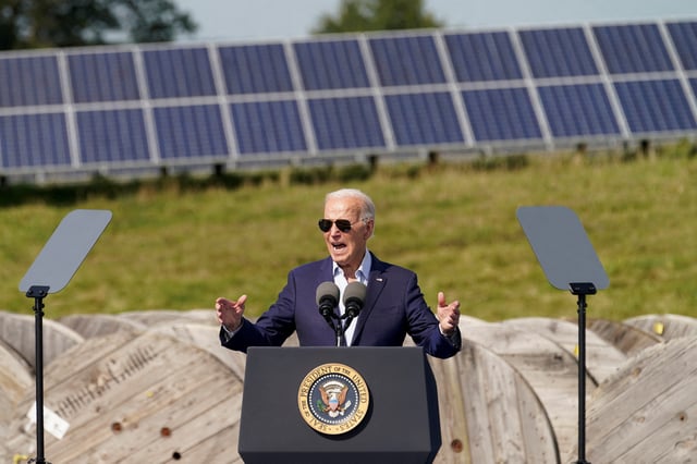 Solar panels at the background as U.S. President Joe Biden speaks during a visit to Vernon Electric Cooperative in Westby, Wisconsin, U.S., September 5, 2024. REUTERS/Kevin Lamarque/File Photo