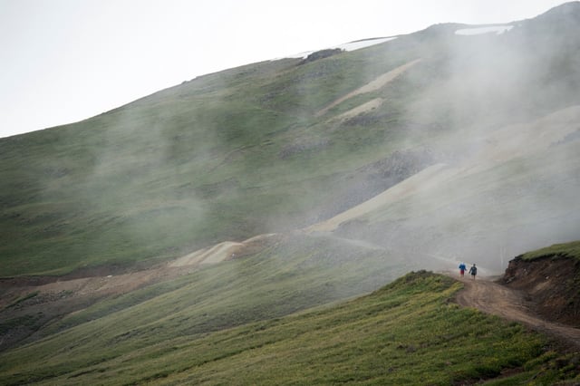 A runner and his pacesetter climb up Engineer Pass during the Hardrock 100 endurance run through the San Juan Mountains on July 14, 2017, near Silverton. The 100.5-mile course loops runners from Silverton to Lake City, Ouray and Telluride.
