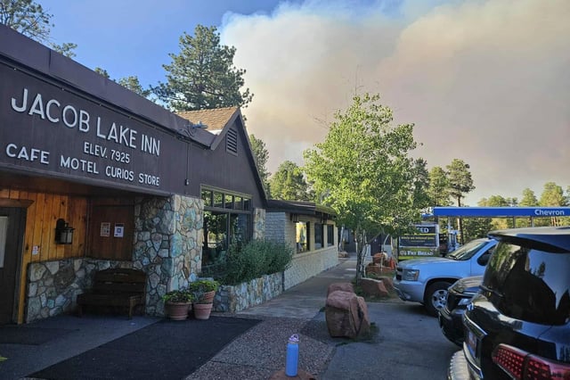 This photo provided by Melinda Rich shows smoke from a wildfire behind the Jacob Lake Inn in Jacob Lake, Ariz., on Thursday, July 10, 2025. (Melinda Rich via AP)