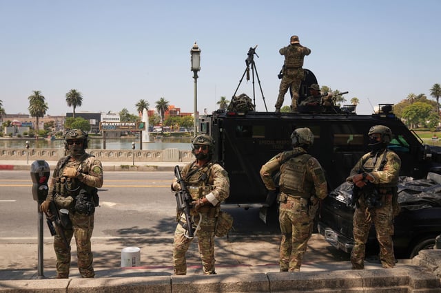 Federal agents stage at MacArthur Park in Los Angeles on July 7, 2025.