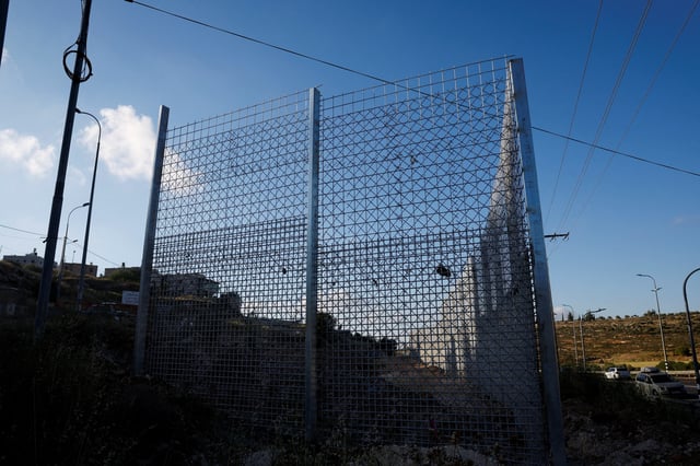 A view shows a part of the fence, which was set by the Israeli authorities, in Sinjil, near Ramallah, in the Israeli-occupied West Bank May 5, 2025. REUTERS/Mohammed Torokman/File Photo