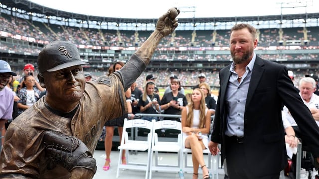 Mark Buehrle stands beside a new bronze statue of the former Chicago White Sox pitcher that was unveiled along the right-field concourse at Rate Field on Friday, July 11, 2025, in Chicago. (Chris Sweda/Chicago Tribune/TNS)