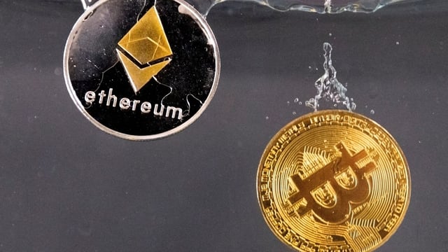 Souvenir tokens representing cryptocurrency Bitcoin and the Ethereum network, with its native token ether.